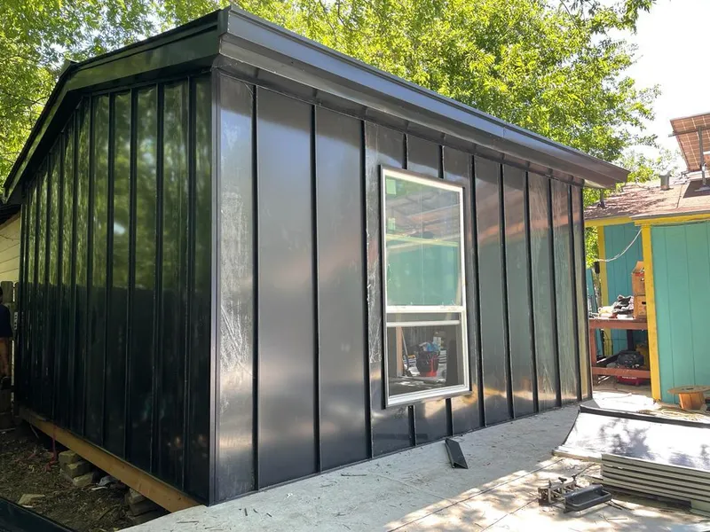 Black standing seam metal wall panels for Roof Inspection in Dunbar